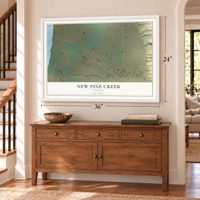 New Pine Creek, Oregon map, 24 x 36 inch print in a white frame above a dresser by a staircase