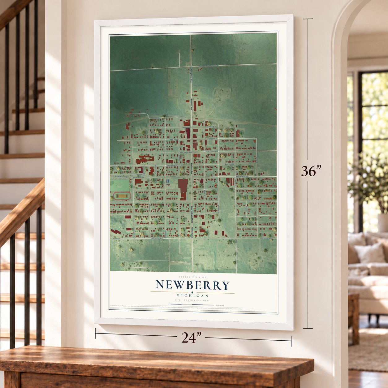 Newberry, Michigan map, 24 x 36 inch print in a white frame by a staircase