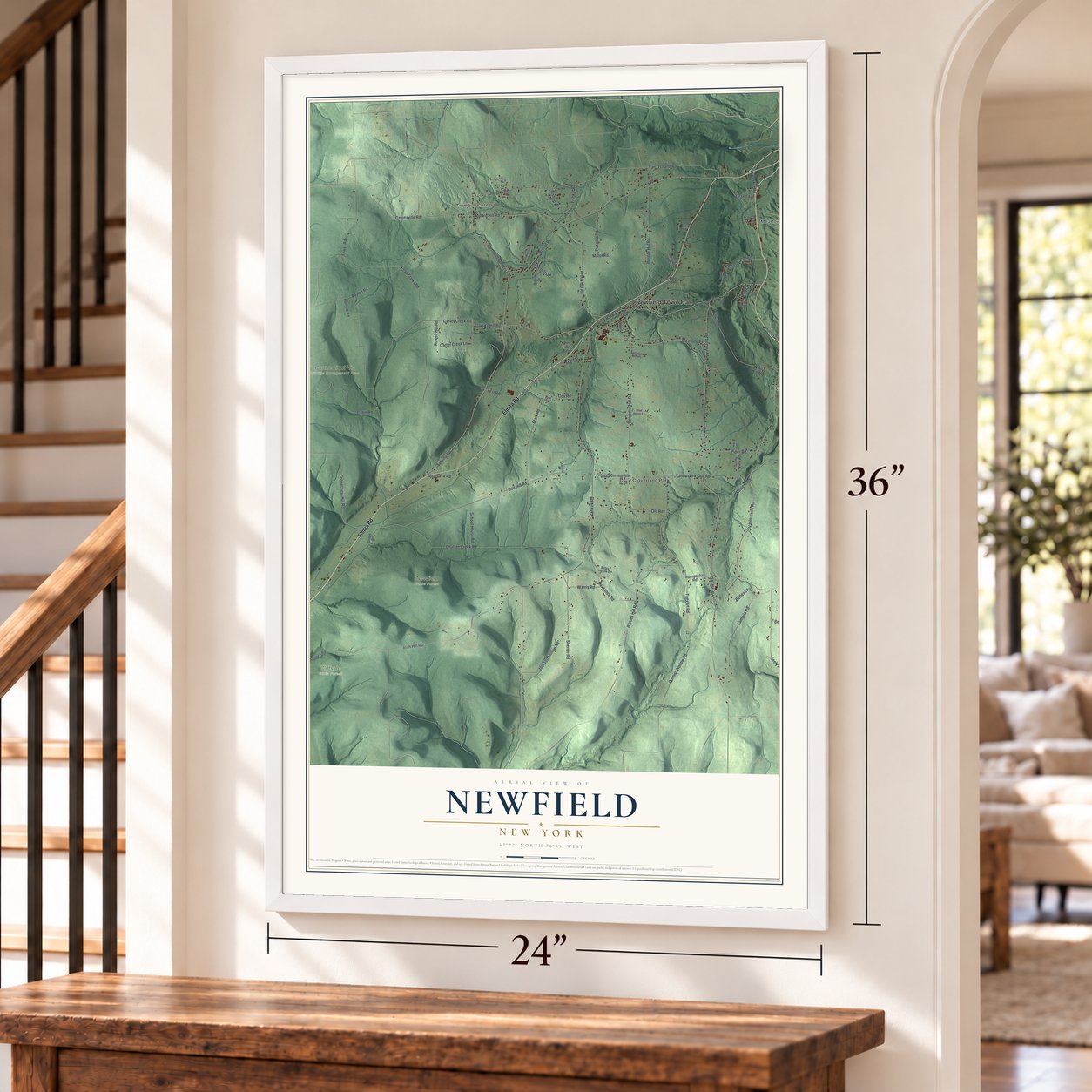 Newfield, New York map, 24 x 36 inch print in a white frame by a staircase