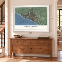 Newport Beach, California map, 24 x 36 inch print in a white frame above a dresser by a staircase