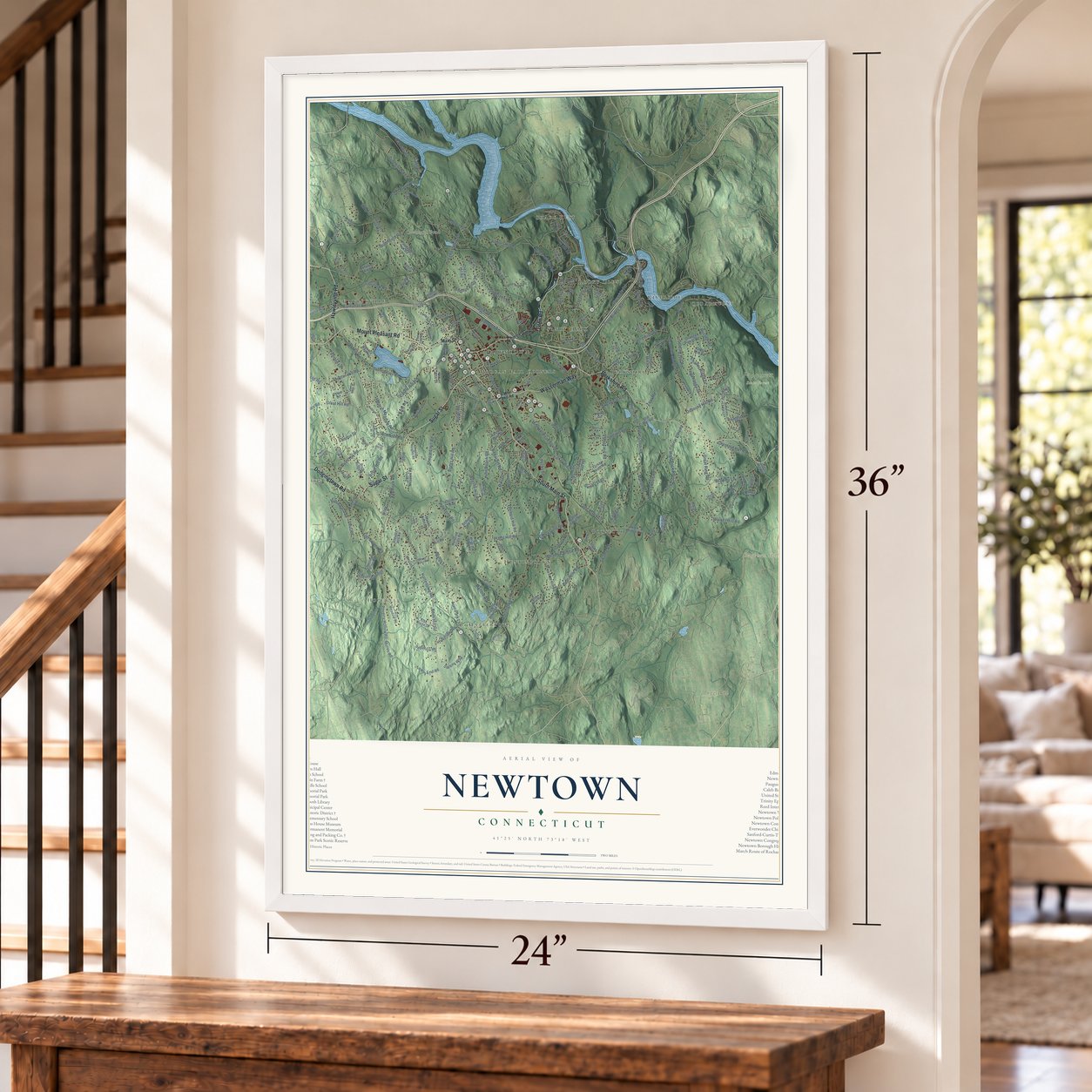 Newtown, Connecticut map, 24 x 36 inch print in a white frame by a staircase