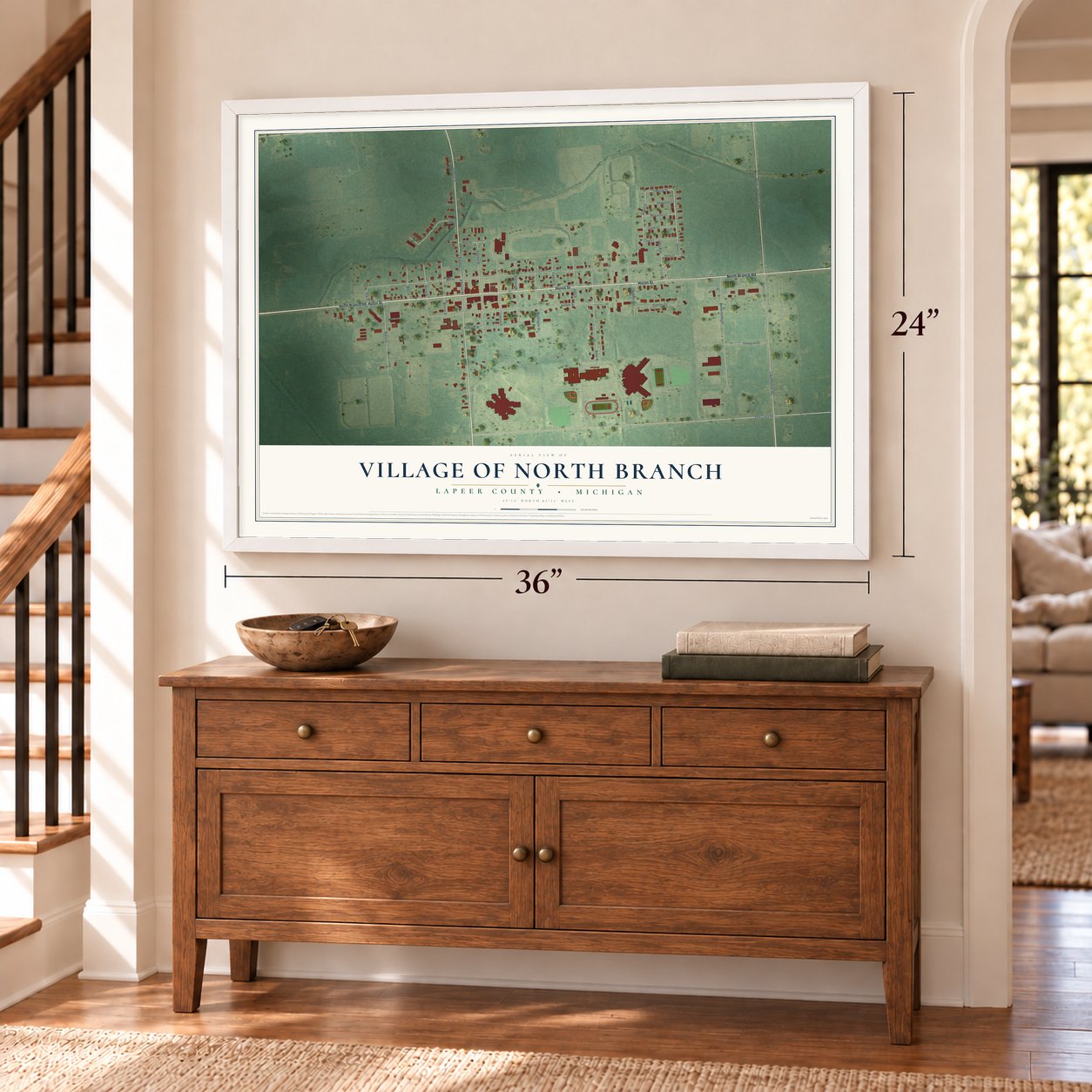 North Branch, Michigan map, 24 x 36 inch print in a white frame above a dresser by a staircase