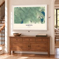Norton, Vermont map, 24 x 36 inch print in a white frame above a dresser by a staircase