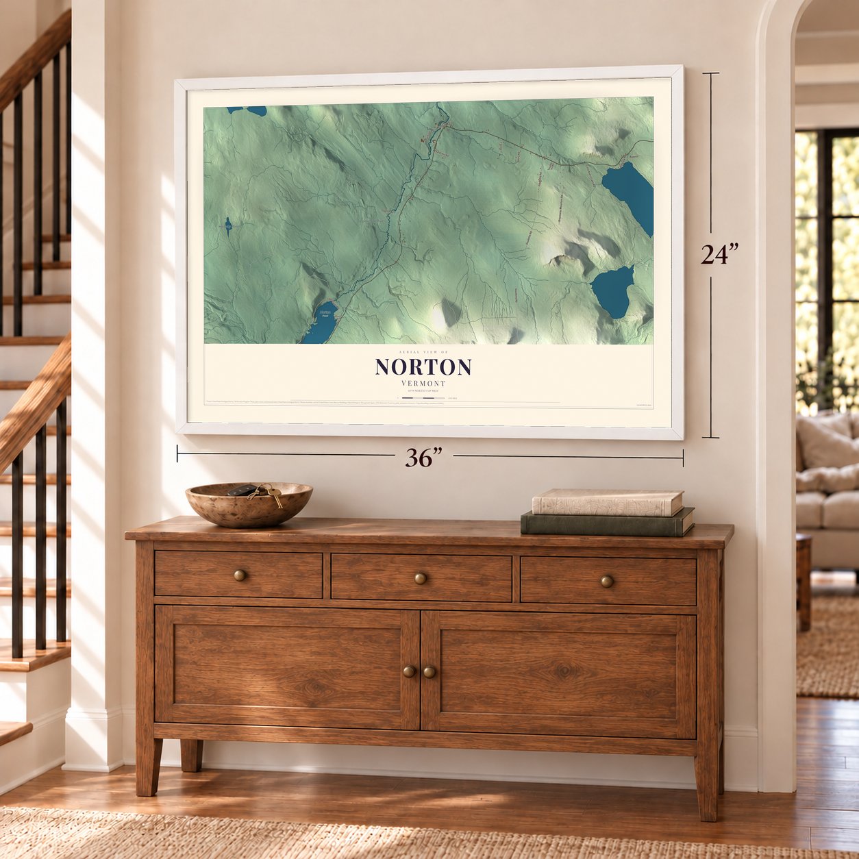 Norton, Vermont map, 24 x 36 inch print in a white frame above a dresser by a staircase