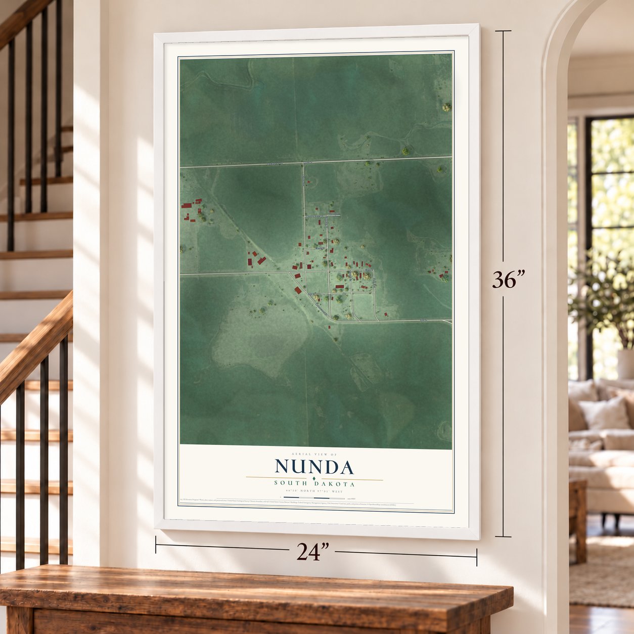 Nunda, South Dakota map, 24 x 36 inch print in a white frame by a staircase