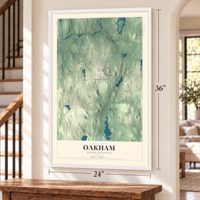 Oakham, Massachusetts map, 24 x 36 inch print in a white frame by a staircase