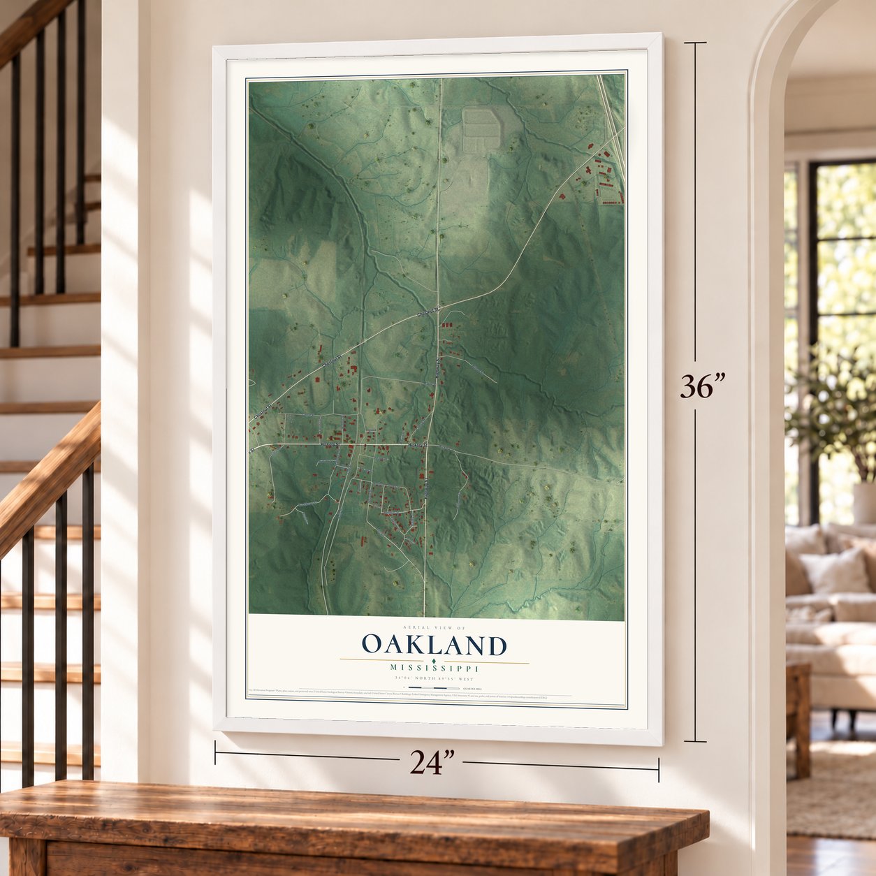Oakland, Mississippi map, 24 x 36 inch print in a white frame by a staircase