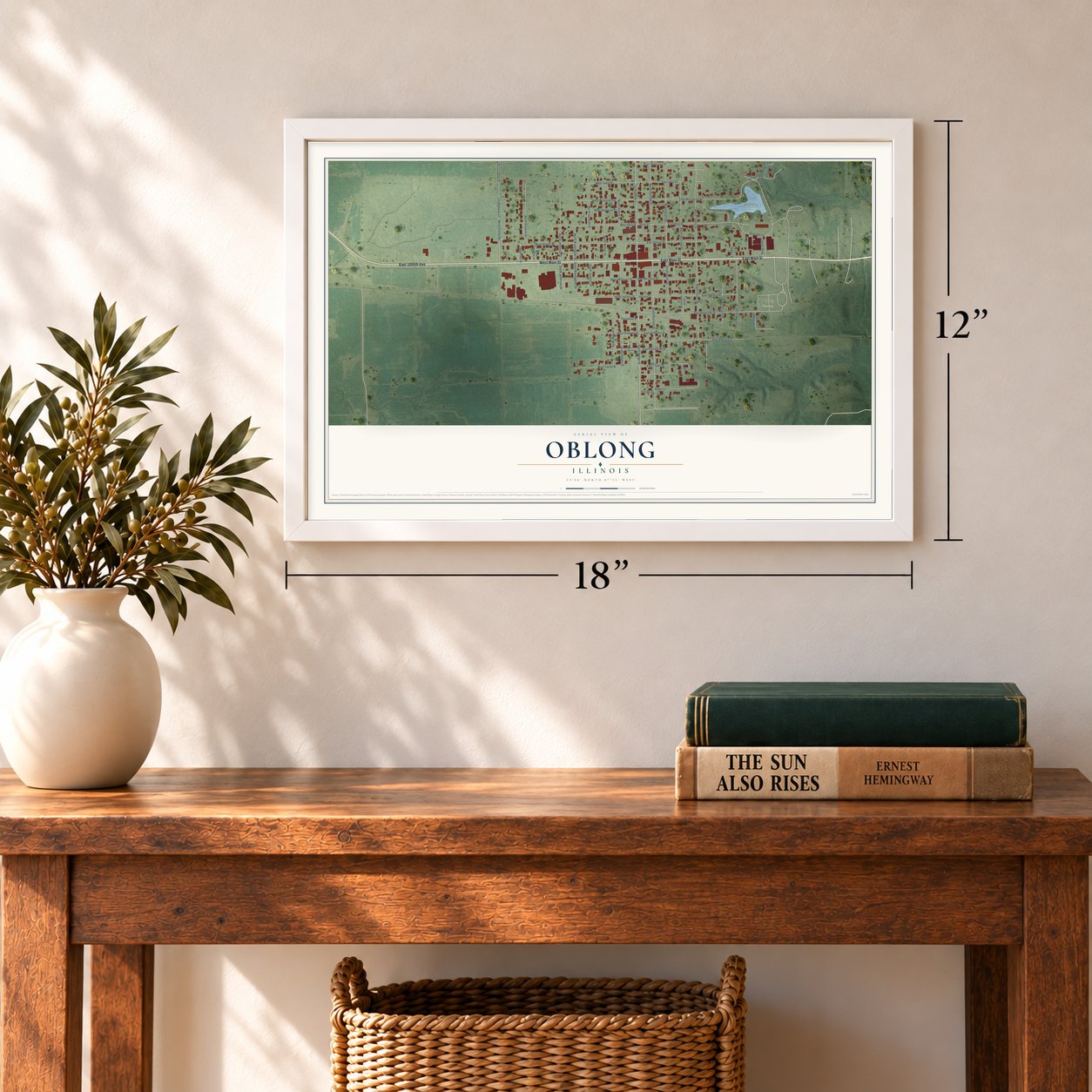 Oblong, Illinois map, 12 x 18 inch print in a white frame in an entryway