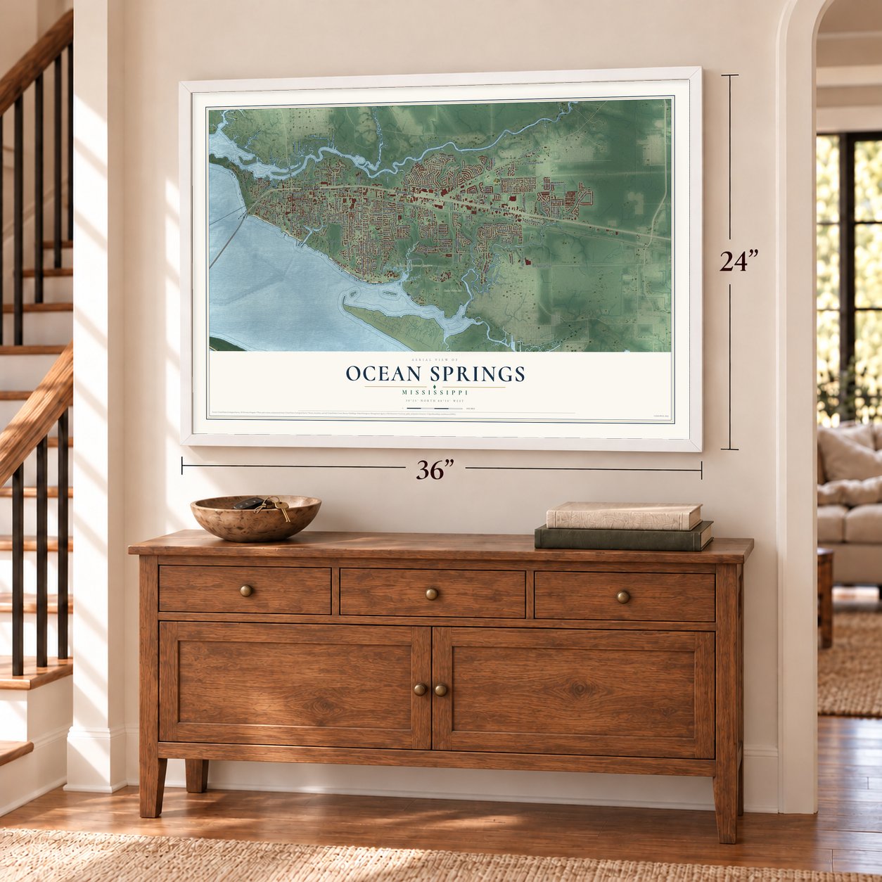 Ocean Springs, Mississippi map, 24 x 36 inch print in a white frame above a dresser by a staircase