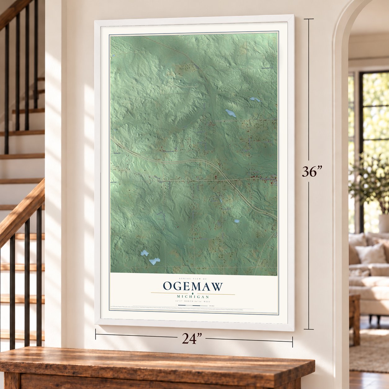 Ogemaw, Michigan map, 24 x 36 inch print in a white frame by a staircase