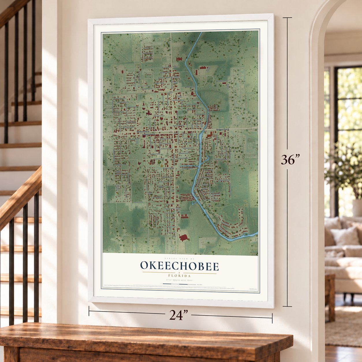 Okeechobee, Florida map, 24 x 36 inch print in a white frame by a staircase