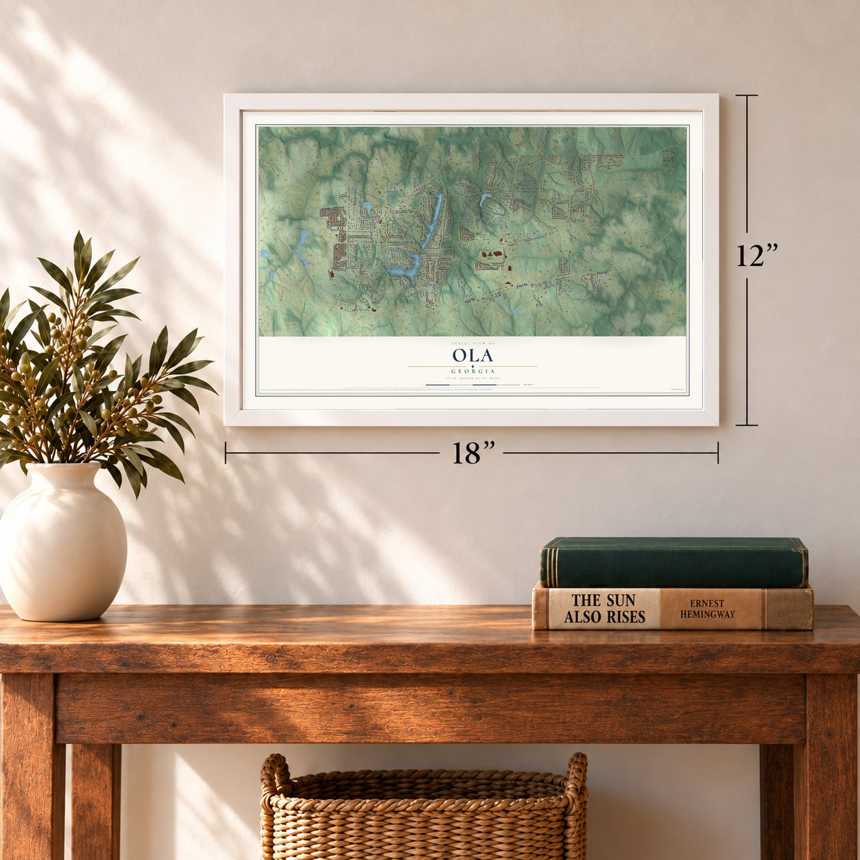 Ola, Georgia map, 12 x 18 inch print in a white frame in an entryway