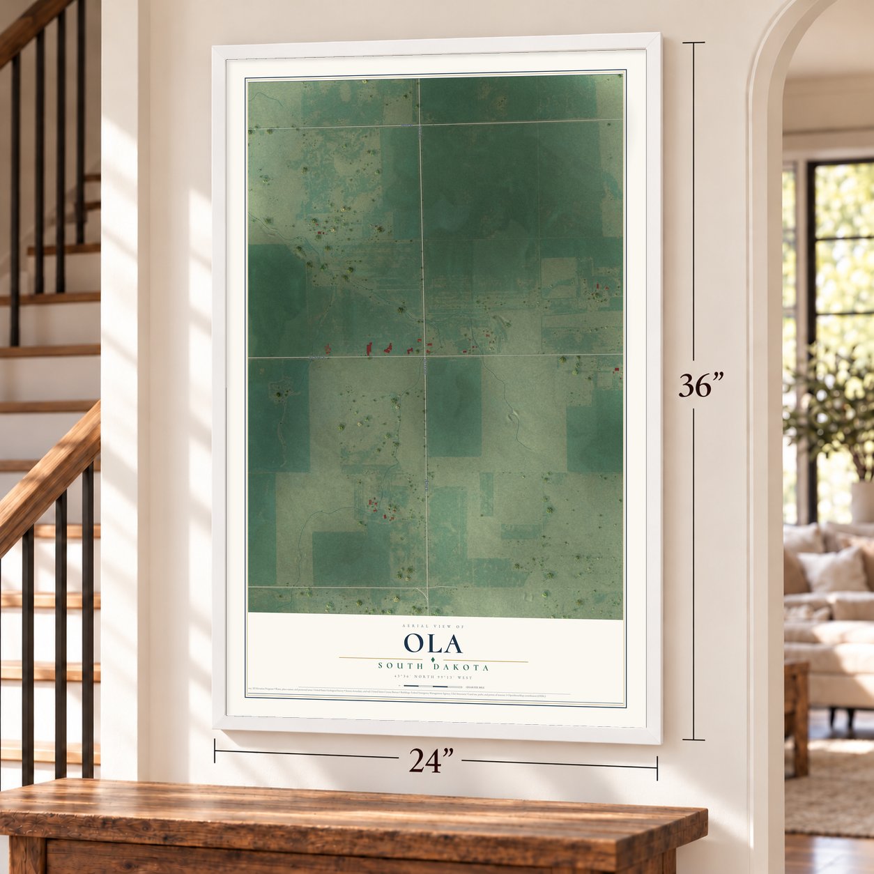Ola, South Dakota map, 24 x 36 inch print in a white frame by a staircase