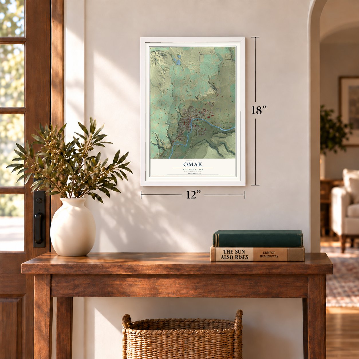 Omak, Washington map, 12 x 18 inch print in a white frame in an entryway