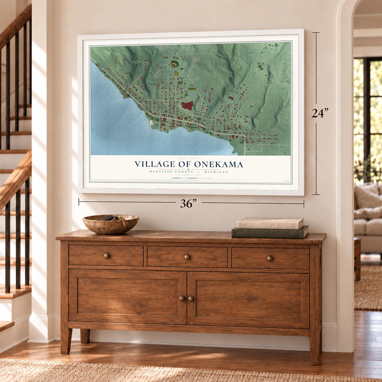 Onekama, Michigan map, 24 x 36 inch print in a white frame above a dresser by a staircase