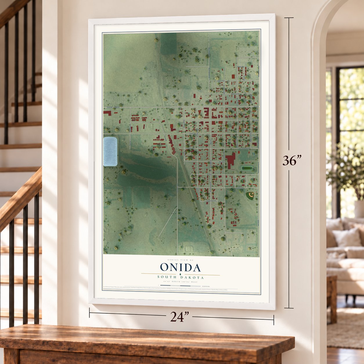 Onida, South Dakota map, 24 x 36 inch print in a white frame by a staircase