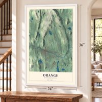 Orange, Massachusetts map, 24 x 36 inch print in a white frame by a staircase
