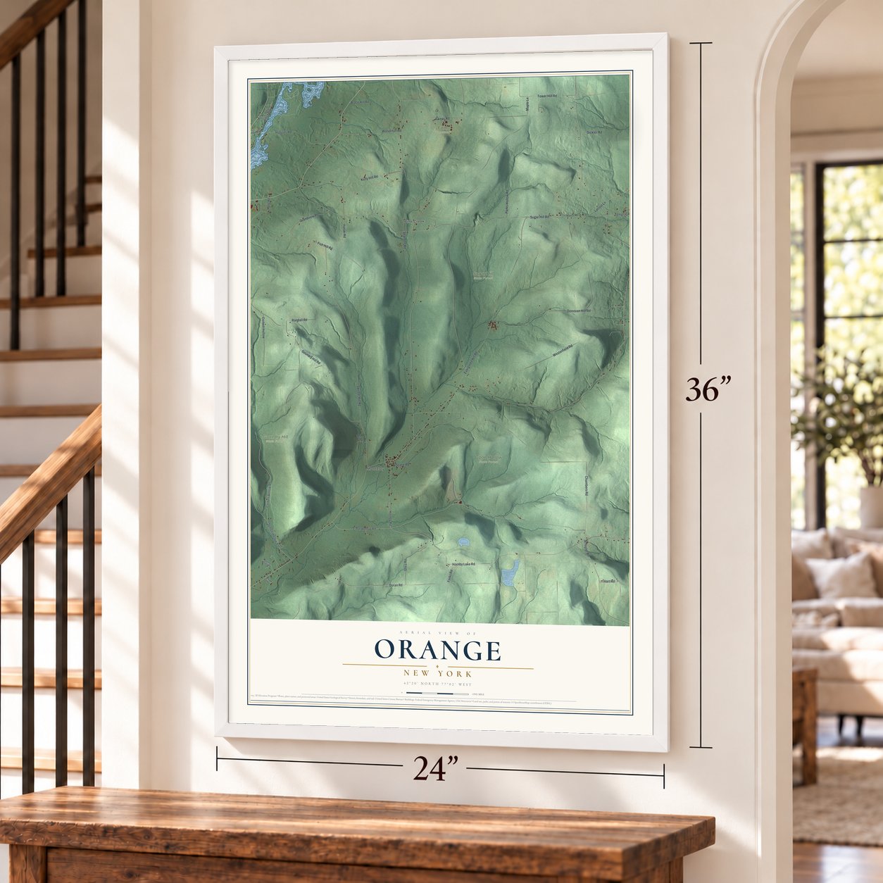 Orange, New York map, 24 x 36 inch print in a white frame by a staircase