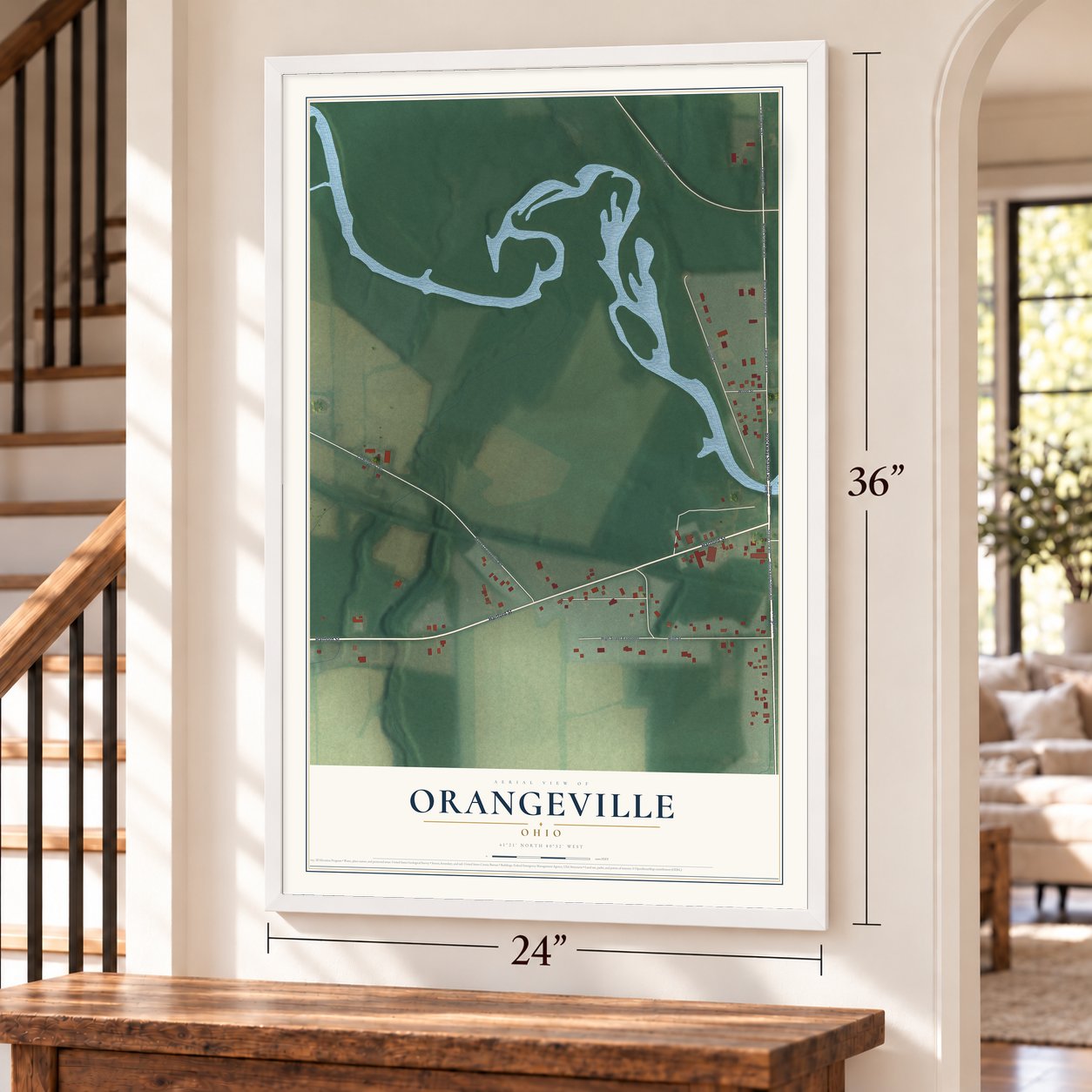 Orangeville, Ohio map, 24 x 36 inch print in a white frame by a staircase