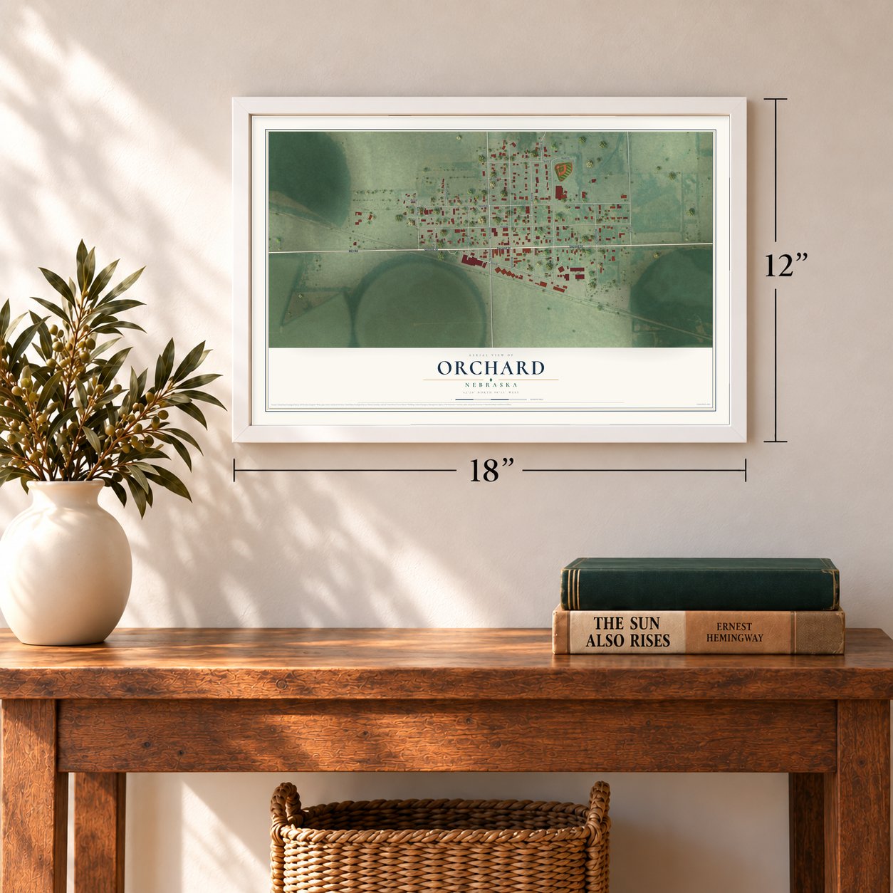 Orchard, Nebraska map, 12 x 18 inch print in a white frame in an entryway
