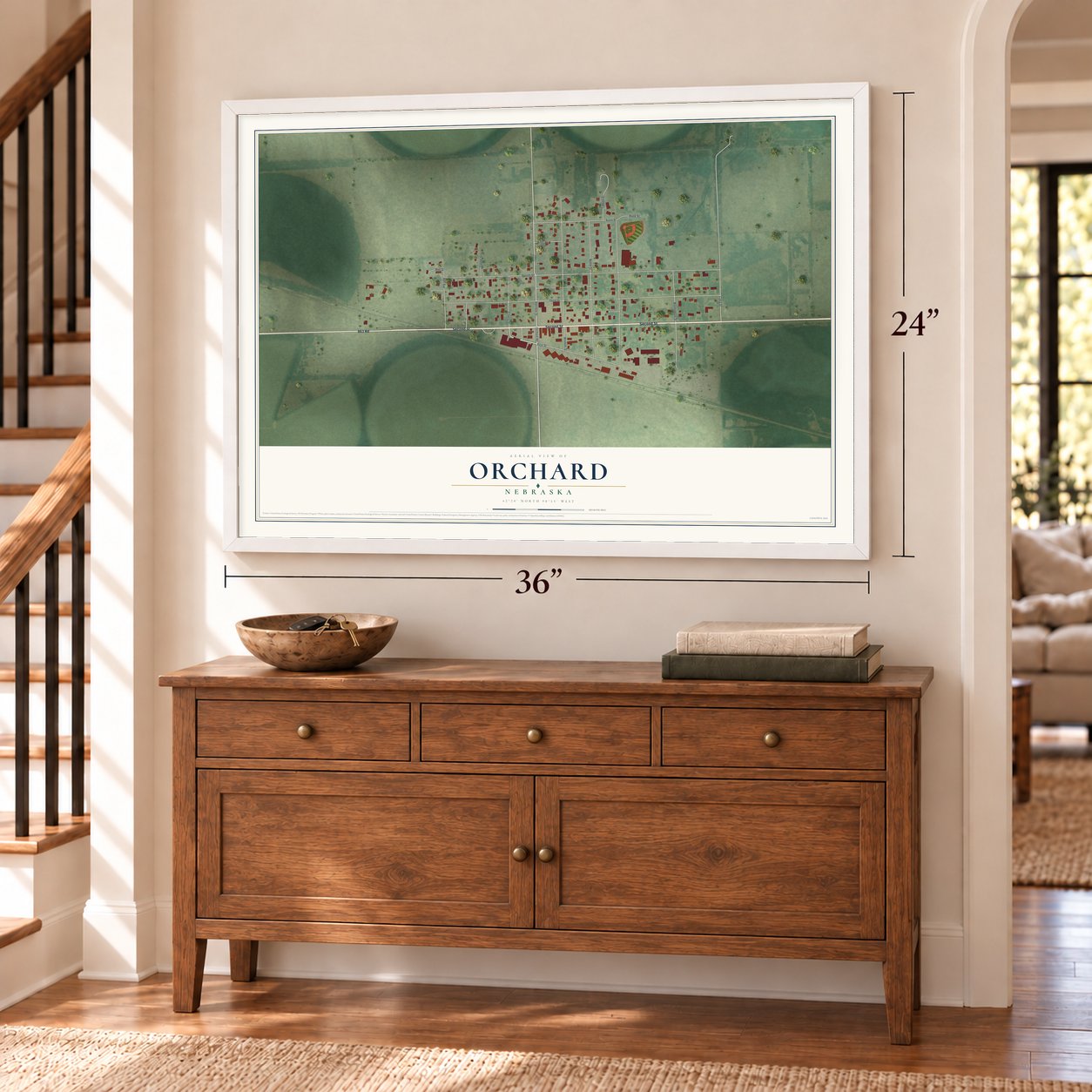 Orchard, Nebraska map, 24 x 36 inch print in a white frame above a dresser by a staircase