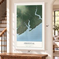 Oriental, North Carolina map, 24 x 36 inch print in a white frame by a staircase