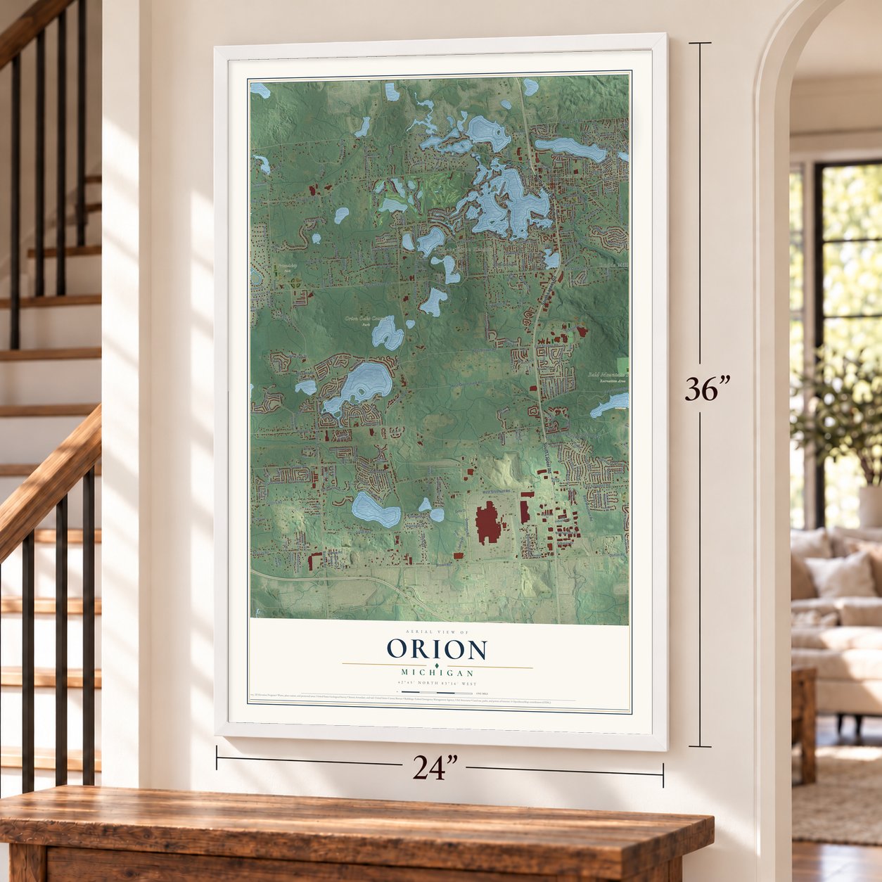 Orion, Michigan map, 24 x 36 inch print in a white frame by a staircase