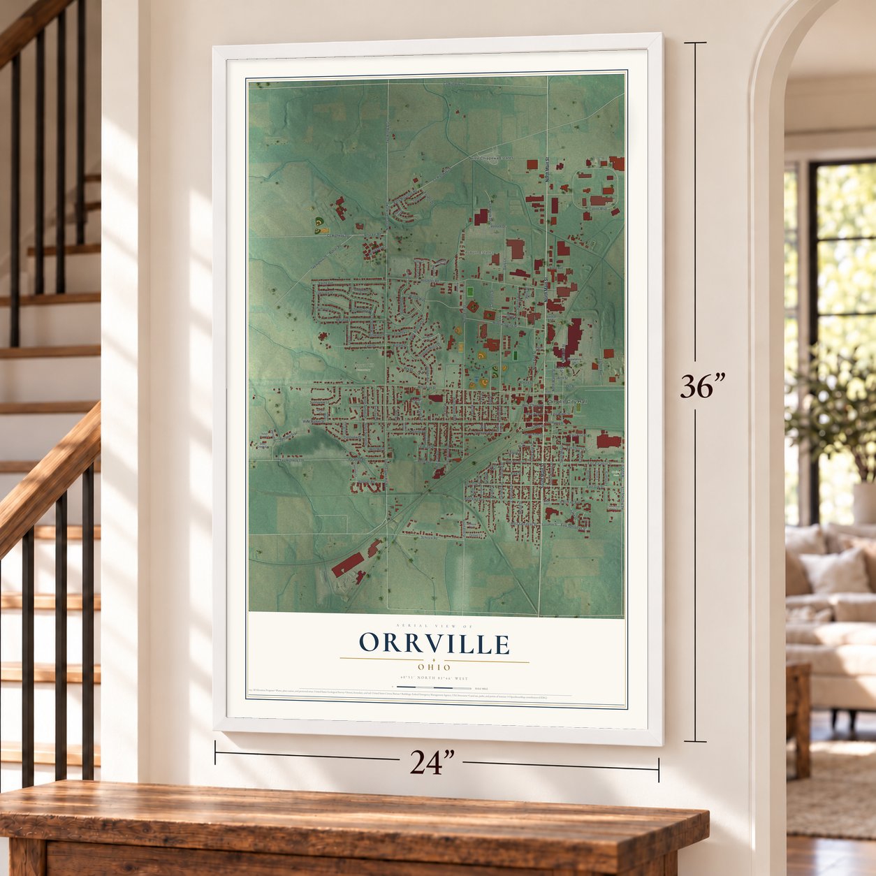 Orrville, Ohio map, 24 x 36 inch print in a white frame by a staircase