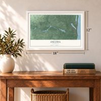 Oscoda, Michigan map, 12 x 18 inch print in a white frame in an entryway