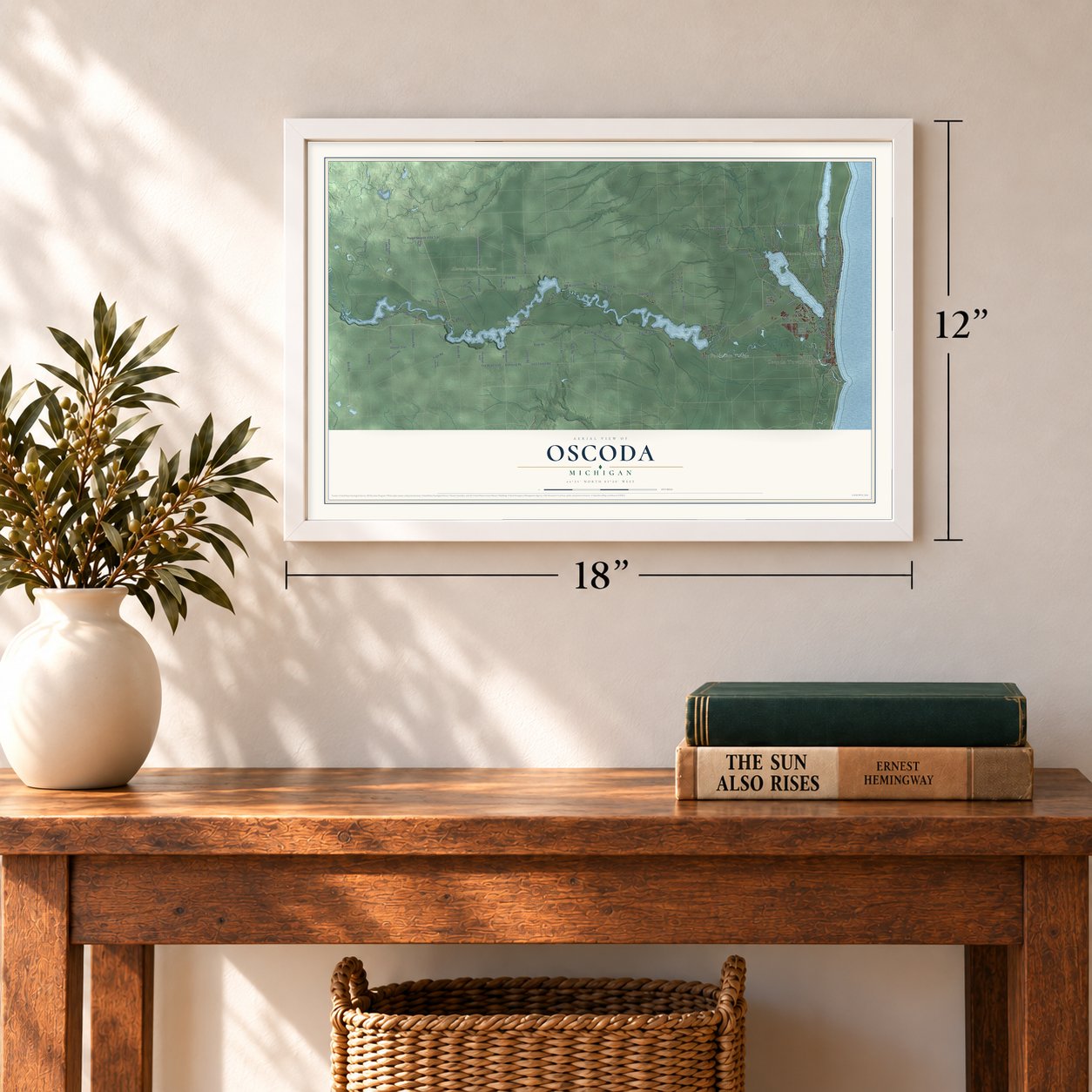 Oscoda, Michigan map, 12 x 18 inch print in a white frame in an entryway