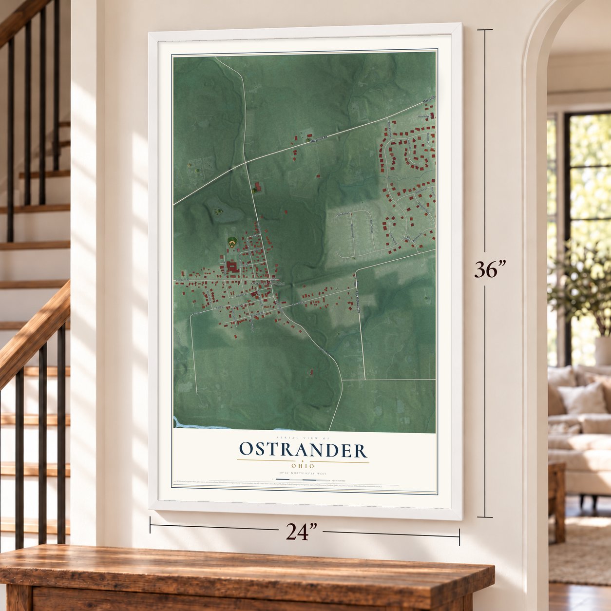 Ostrander, Ohio map, 24 x 36 inch print in a white frame by a staircase