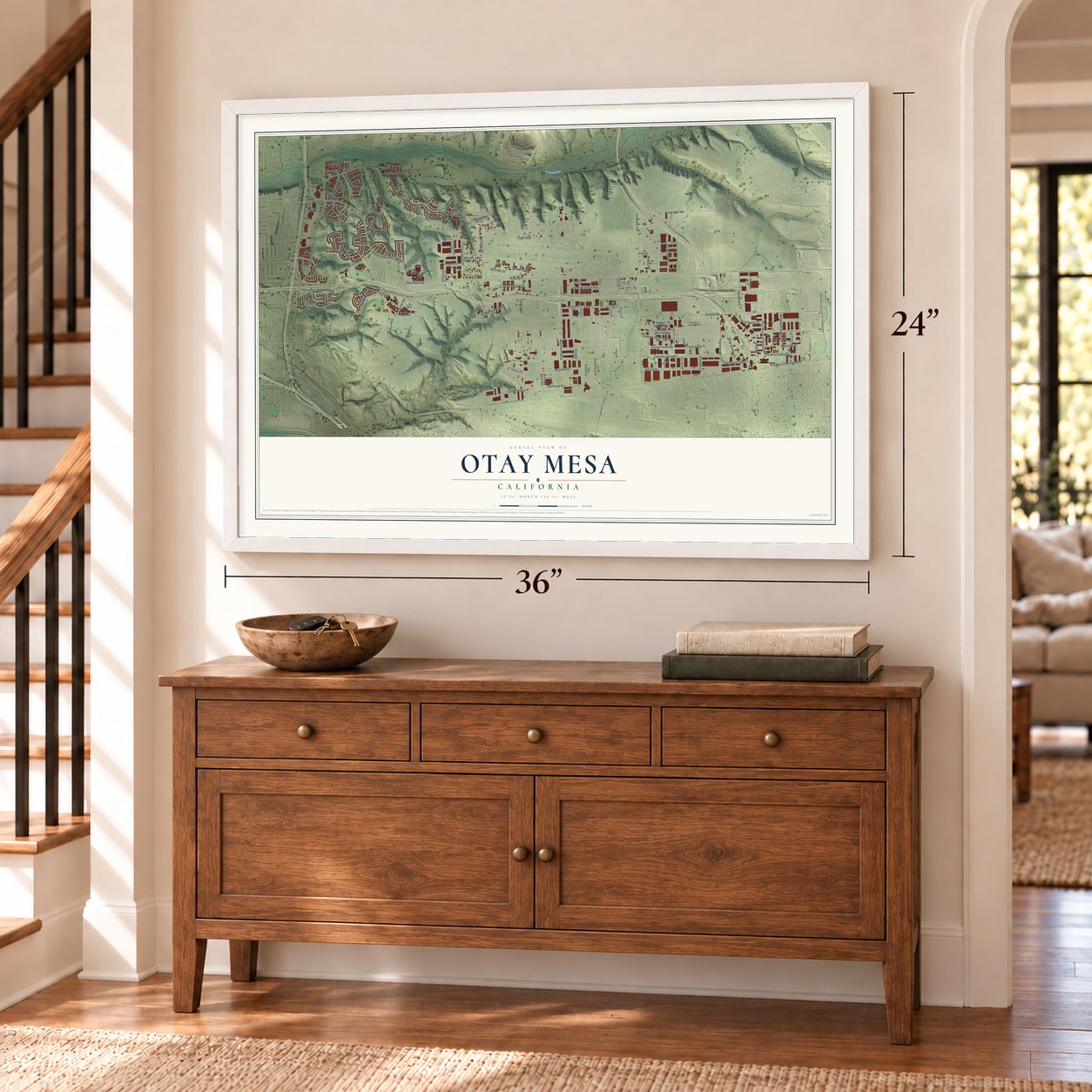 Otay Mesa, California map, 24 x 36 inch print in a white frame above a dresser by a staircase
