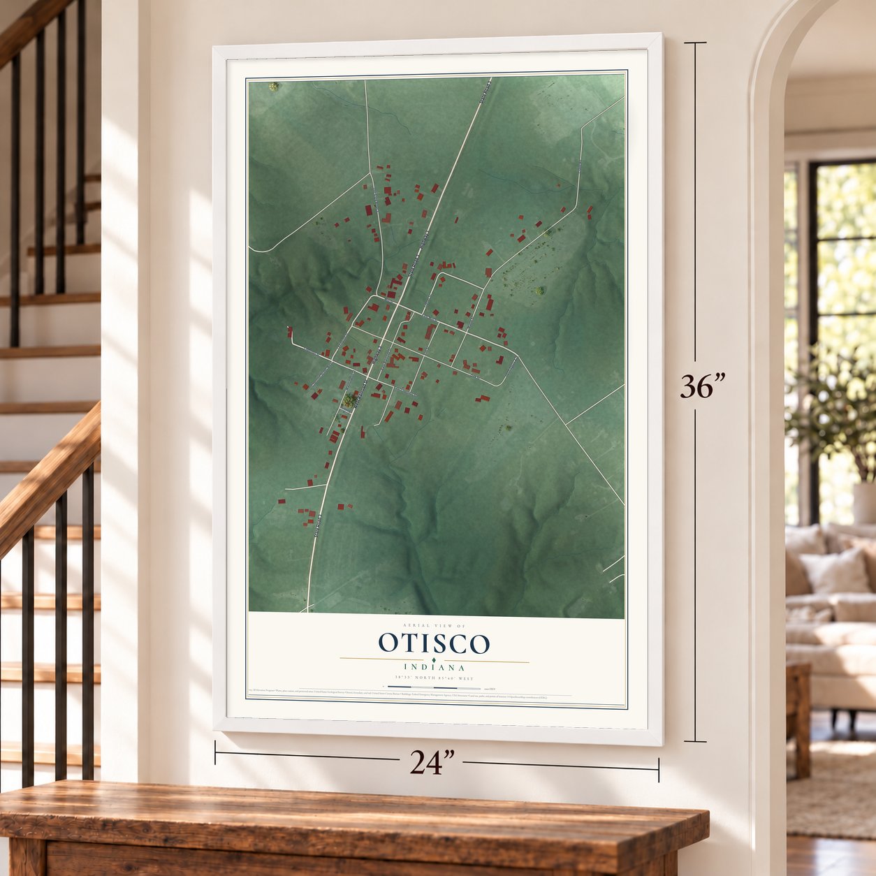 Otisco, Indiana map, 24 x 36 inch print in a white frame by a staircase