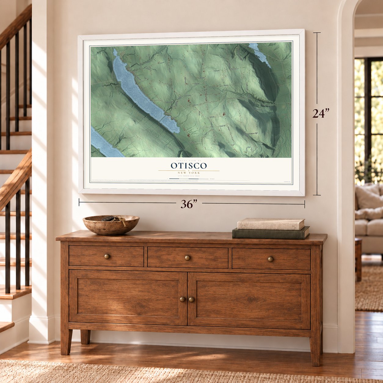 Otisco, New York map, 24 x 36 inch print in a white frame above a dresser by a staircase
