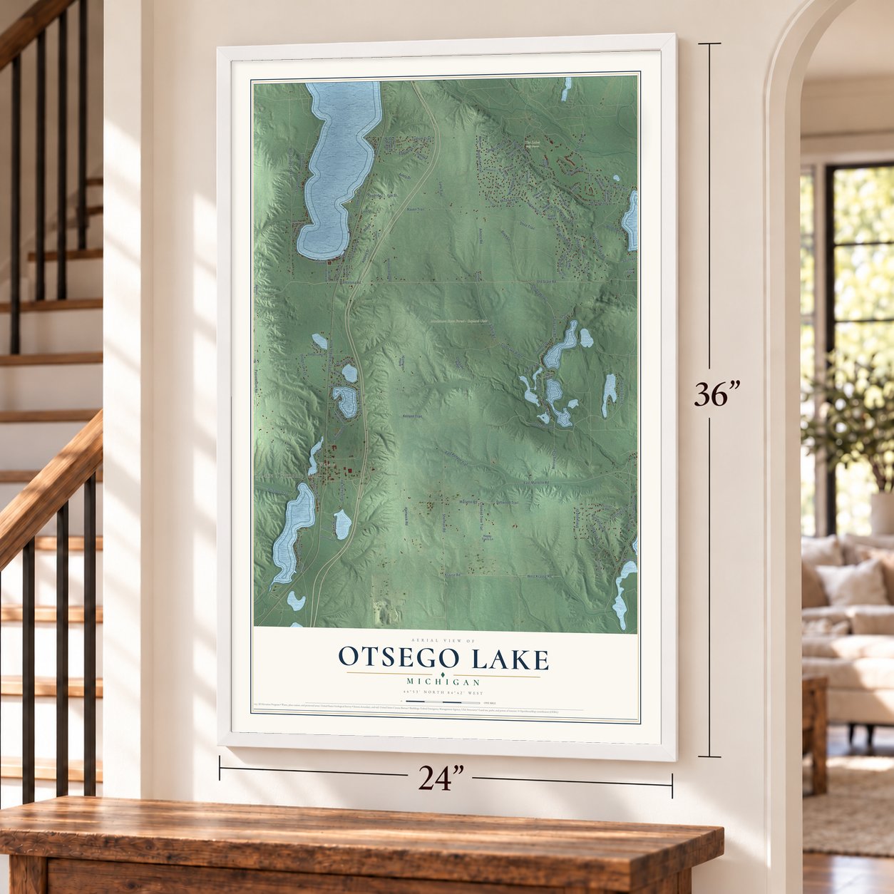 Otsego Lake, Michigan map, 24 x 36 inch print in a white frame by a staircase
