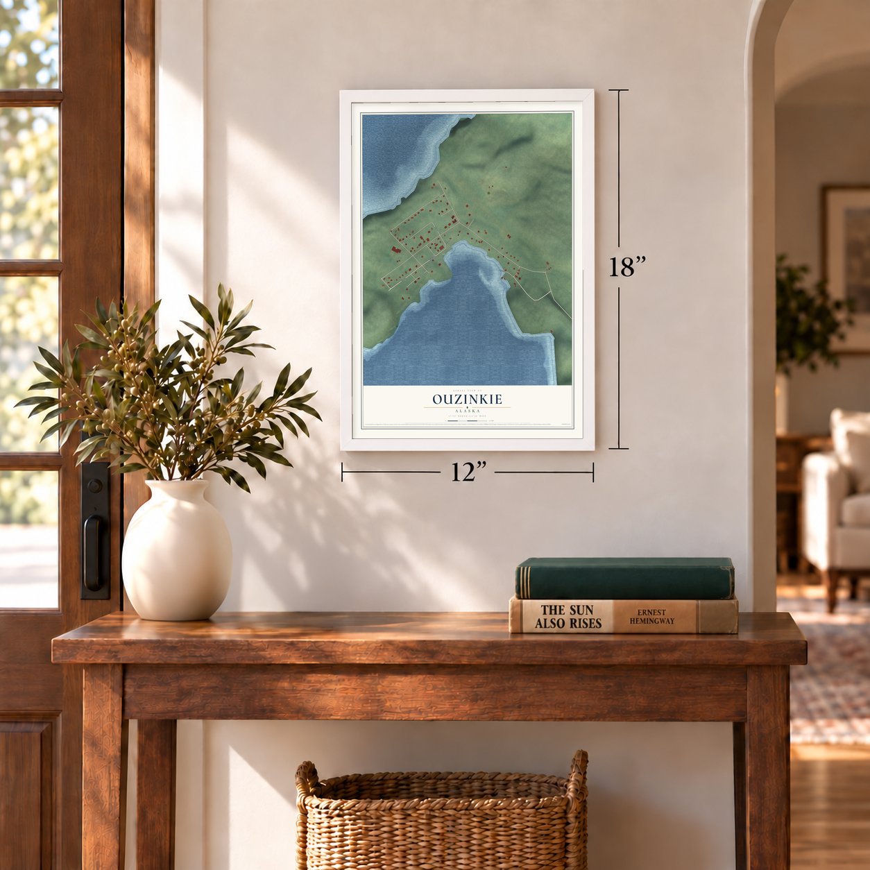 Ouzinkie, Alaska map, 12 x 18 inch print in a white frame in an entryway