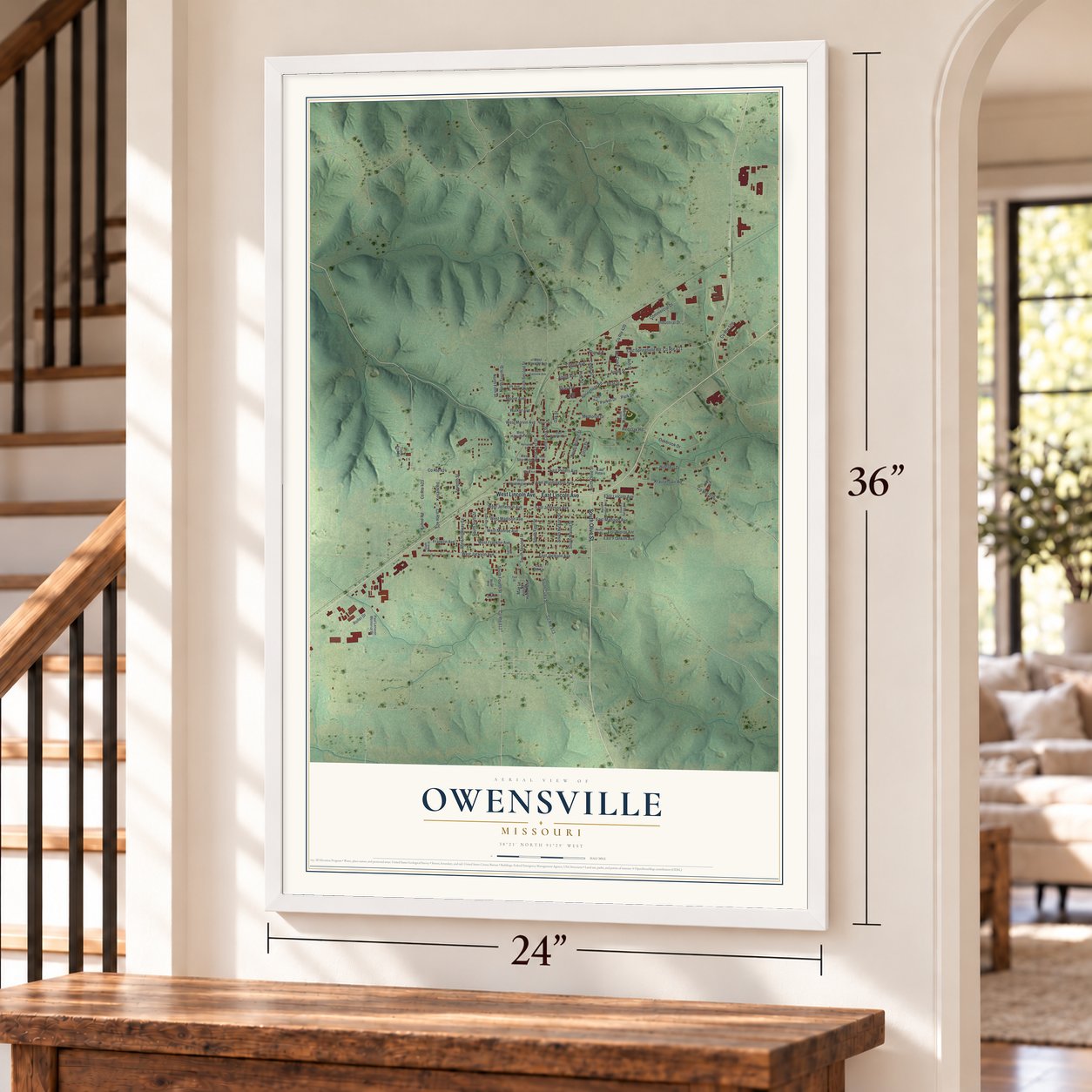 Owensville, Missouri map, 24 x 36 inch print in a white frame by a staircase