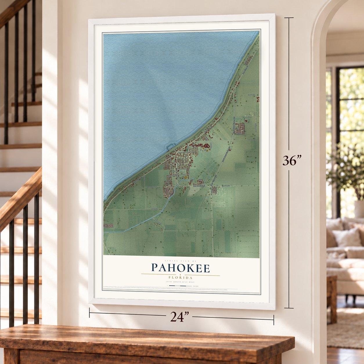 Pahokee, Florida map, 24 x 36 inch print in a white frame by a staircase