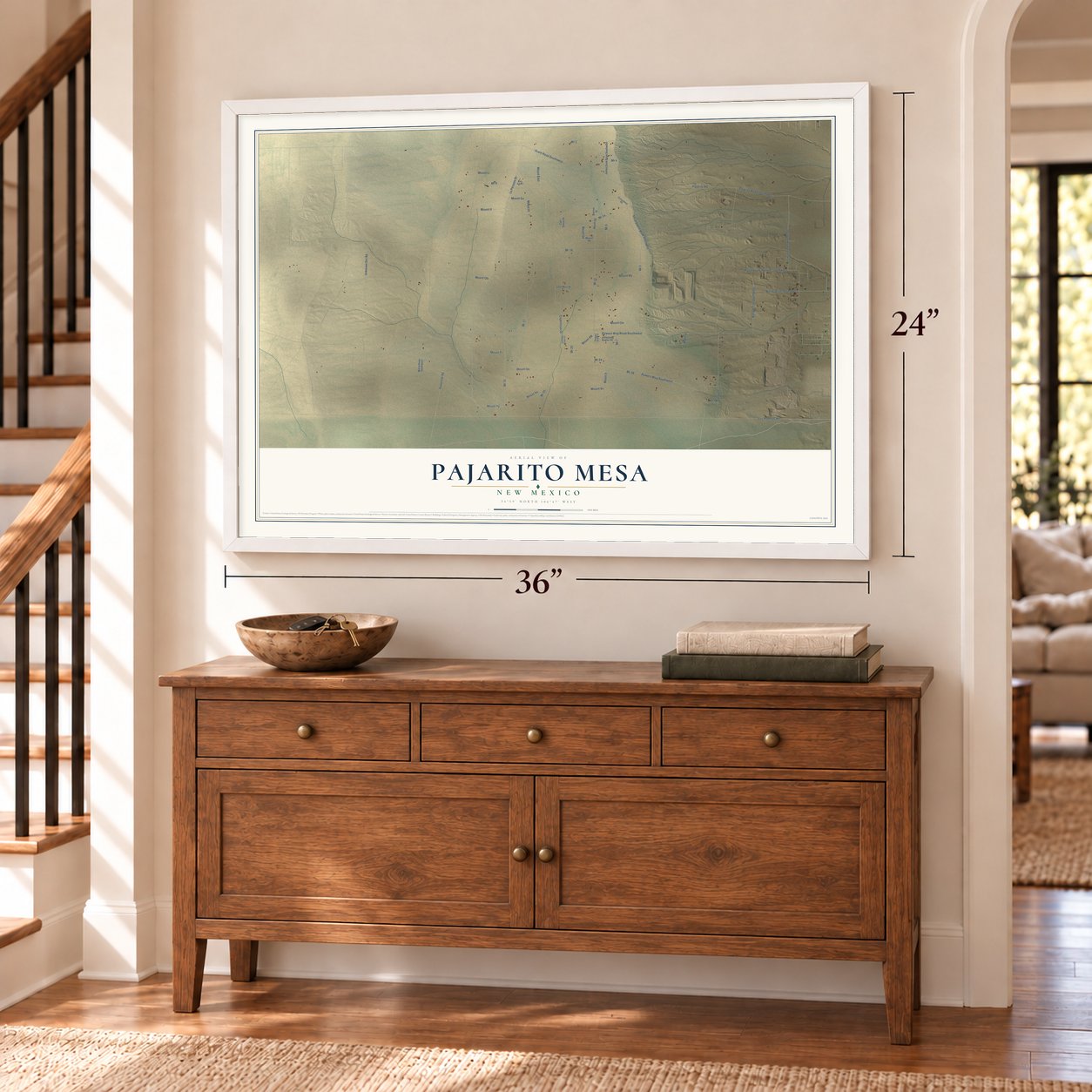 Pajarito Mesa, New Mexico map, 24 x 36 inch print in a white frame above a dresser by a staircase