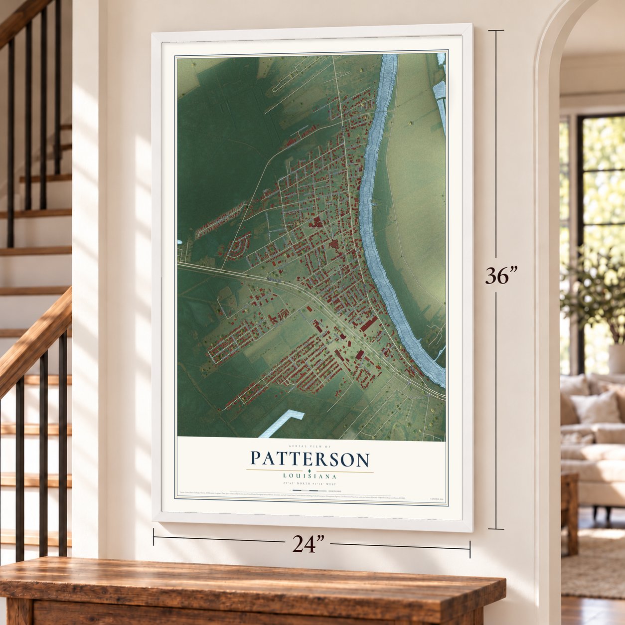 Patterson, Louisiana map, 24 x 36 inch print in a white frame by a staircase