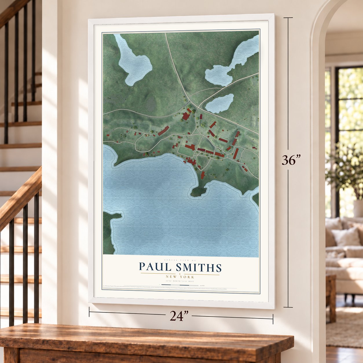 Paul Smiths, New York map, 24 x 36 inch print in a white frame by a staircase