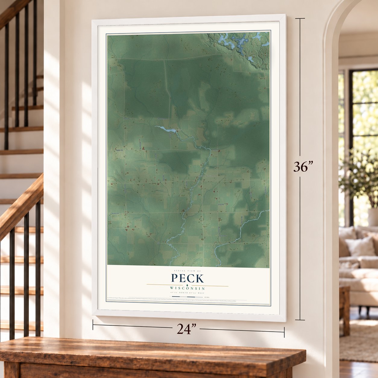 Peck, Wisconsin map, 24 x 36 inch print in a white frame by a staircase