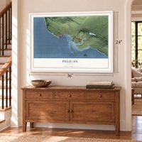 Pelican, Alaska map, 24 x 36 inch print in a white frame above a dresser by a staircase
