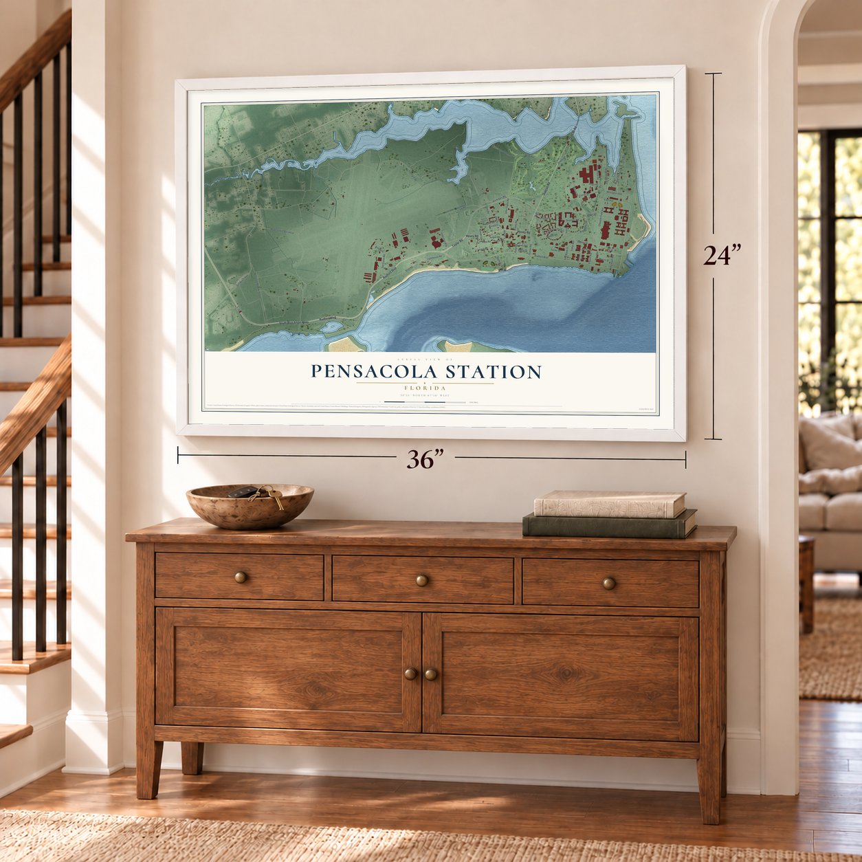 Pensacola Station, Florida map, 24 x 36 inch print in a white frame above a dresser by a staircase