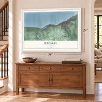 Petoskey, Michigan map, 24 x 36 inch print in a white frame above a dresser by a staircase