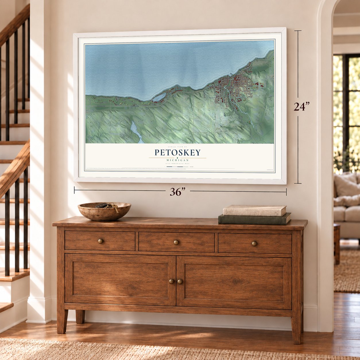 Petoskey, Michigan map, 24 x 36 inch print in a white frame above a dresser by a staircase