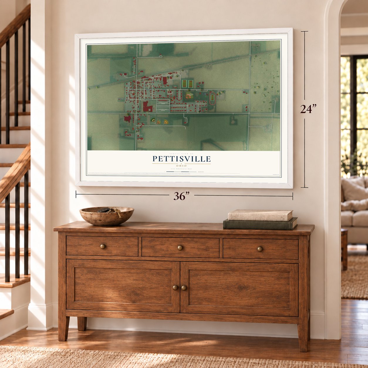 Pettisville, Ohio map, 24 x 36 inch print in a white frame above a dresser by a staircase