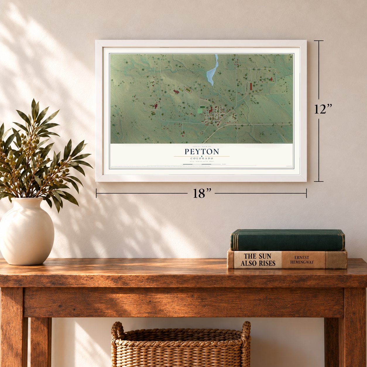 Peyton, Colorado map, 12 x 18 inch print in a white frame in an entryway