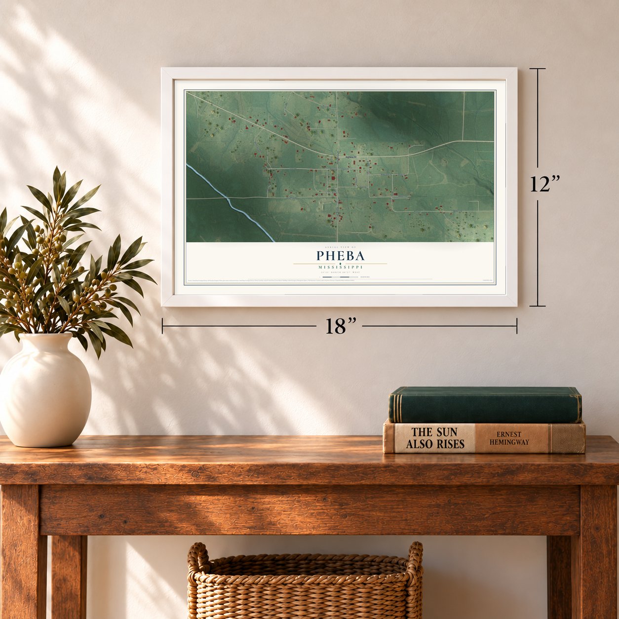 Pheba, Mississippi map, 12 x 18 inch print in a white frame in an entryway
