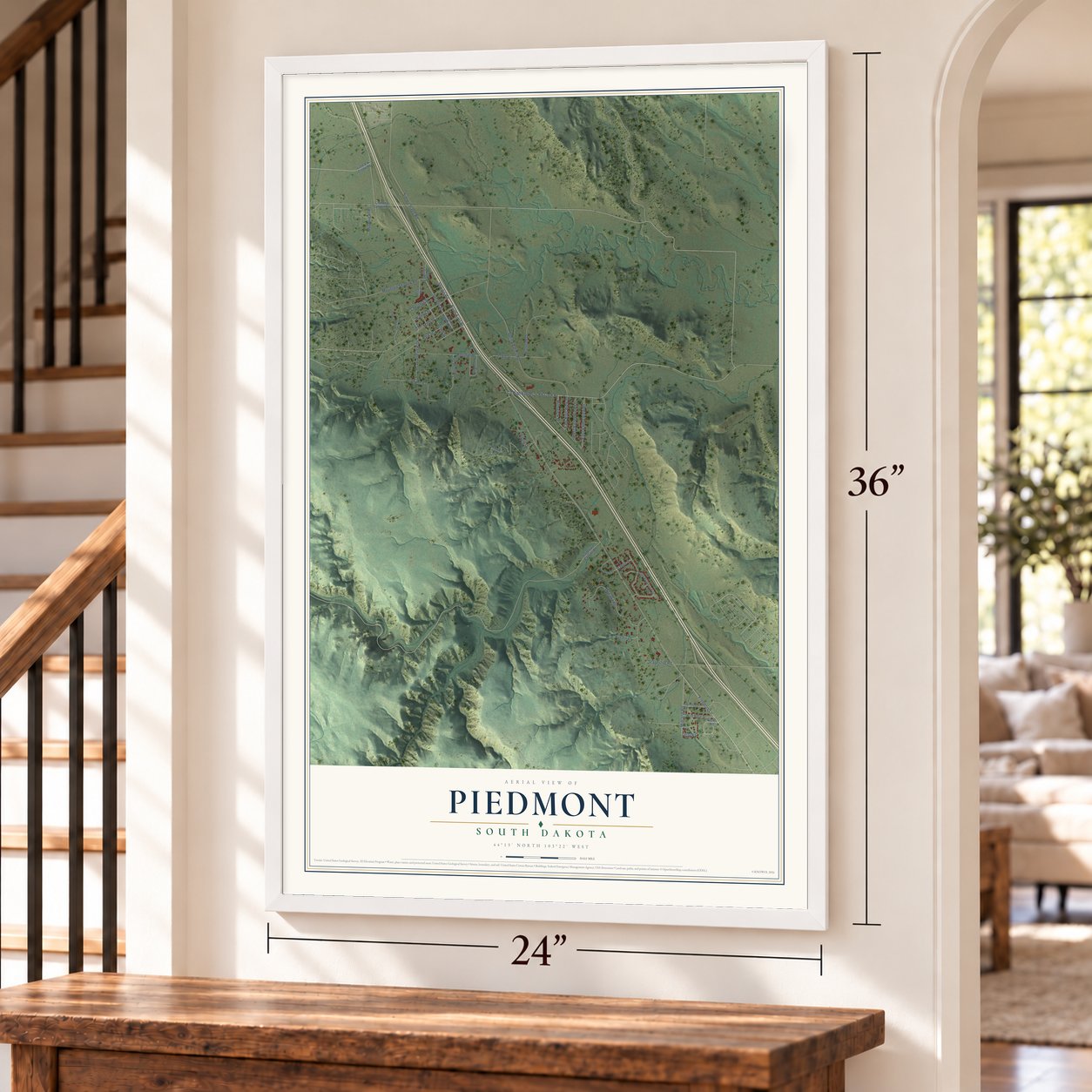 Piedmont, South Dakota map, 24 x 36 inch print in a white frame by a staircase